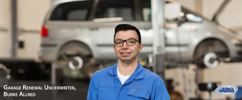 Burke Allred Garage Renewal Underwriter dressed as mechanic in garage