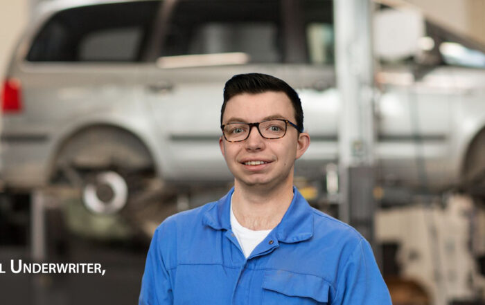 Burke Allred Garage Renewal Underwriter dressed as mechanic in garage